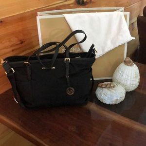 Beautiful black and gold MK baby bag.